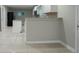Bright kitchen featuring granite countertops, an island, and a black refrigerator at 3409 Hyland Dr, Decatur, GA 30032