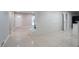 Open-concept living room featuring tile flooring, white-washed brick fireplace and ample natural light from windows at 3409 Hyland Dr, Decatur, GA 30032