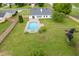 Aerial shot of backyard pool, patio, lawn and fence at 4735 Widgeon Way, Cumming, GA 30028