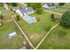 Wide aerial view of a fenced-in yard with an inground pool, landscaping, and home exterior at 4735 Widgeon Way, Cumming, GA 30028