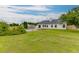 Expansive backyard featuring a lush lawn, privacy fence, and a view of the home's rear exterior at 4735 Widgeon Way, Cumming, GA 30028