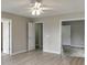 Bright and airy bedroom featuring two doors and neutral walls and floors at 4735 Widgeon Way, Cumming, GA 30028
