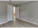 Bedroom with neutral wall paint and wood floor at 4735 Widgeon Way, Cumming, GA 30028