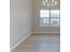 Elegant dining area with wood flooring and ample natural light at 4735 Widgeon Way, Cumming, GA 30028