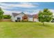 Classic one-story home features a lush green lawn and a welcoming facade at 4735 Widgeon Way, Cumming, GA 30028