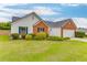 Inviting one-story home with neat lawn and beautiful exterior details at 4735 Widgeon Way, Cumming, GA 30028