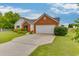 A well-maintained single-story home with a two-car garage and landscaped front yard at 4735 Widgeon Way, Cumming, GA 30028