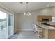 Kitchen with a breakfast bar and a view to an outdoor patio and fence at 4735 Widgeon Way, Cumming, GA 30028