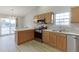 Bright kitchen featuring stainless steel appliances and a breakfast bar at 4735 Widgeon Way, Cumming, GA 30028