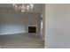 Bright living room with a fireplace, chandelier, and modern flooring at 4735 Widgeon Way, Cumming, GA 30028