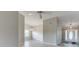 Bright, open-concept living room with wood floors and modern lighting fixtures at 4735 Widgeon Way, Cumming, GA 30028