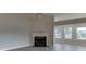 Inviting living room with fireplace, wood flooring, and vaulted ceiling at 4735 Widgeon Way, Cumming, GA 30028