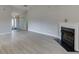 Cozy living room with fireplace and wood flooring, creating a warm atmosphere at 4735 Widgeon Way, Cumming, GA 30028
