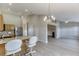 Open concept living space blending kitchen and living room at 4735 Widgeon Way, Cumming, GA 30028