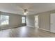 Spacious main bedroom featuring two windows, neutral walls and a door to the bathroom at 4735 Widgeon Way, Cumming, GA 30028