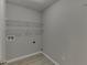 Storage room with wire shelving and wood floor at 4735 Widgeon Way, Cumming, GA 30028