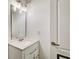 Bathroom featuring white vanity, quartz countertop, modern faucet and stylish light fixture at 1952 Sugarstone Dr, Lawrenceville, GA 30043