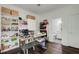 Well lit craft room with hardwood floors, ceiling fan and lots of shelving at 1952 Sugarstone Dr, Lawrenceville, GA 30043