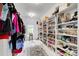 Walk-in closet with custom shelving for shoes and accessories, providing ample storage at 1952 Sugarstone Dr, Lawrenceville, GA 30043