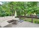 Cozy outdoor deck featuring comfortable seating and a view of the backyard at 1952 Sugarstone Dr, Lawrenceville, GA 30043