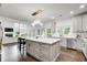 Modern kitchen with a large center island, stainless steel appliances, and ample counter space at 1952 Sugarstone Dr, Lawrenceville, GA 30043