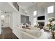 Bright living room with high ceilings, modern fireplace, and geometric accent wall for a modern feel at 1952 Sugarstone Dr, Lawrenceville, GA 30043
