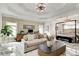 Large main bedroom features marble floors, sitting area, canopy bed and elegant lighting at 1952 Sugarstone Dr, Lawrenceville, GA 30043