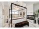 Elegant main bedroom featuring a canopy bed, fireplace, and luxurious details at 1952 Sugarstone Dr, Lawrenceville, GA 30043