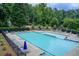Community swimming pool area with ample seating for lounging and relaxing at 1952 Sugarstone Dr, Lawrenceville, GA 30043
