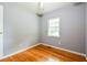 Bedroom featuring hardwood floors, neutral paint, base molding, ceiling fan, and a window at , Forest Park, GA 30297