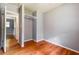 View of bedroom showing hardwood floors, gray walls, a closet, and a doorway at , Forest Park, GA 30297