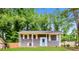 Charming single-story home with gray siding, white trim, and a bright blue front door at , Forest Park, GA 30297