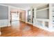 Open-concept living area featuring hardwood floors and built-in shelving at , Forest Park, GA 30297