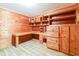 Office with a built in desk, wood paneled walls and ample storage at , Forest Park, GA 30297