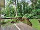 Wooden deck overlooking a lush, green backyard with mature trees at 1625 Orlando Sw St, Atlanta, GA 30311