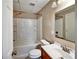 Well-lit bathroom features a tub and shower combination, vanity with a sink, and toilet at 1625 Orlando Sw St, Atlanta, GA 30311