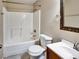 Well-lit bathroom featuring a tub and shower combination, vanity with a sink, and toilet at 1625 Orlando Sw St, Atlanta, GA 30311