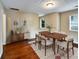 Dining room with a modern table, ample seating, and a decorative rug at 1625 Orlando Sw St, Atlanta, GA 30311