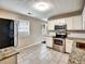 Updated kitchen features stainless appliances, granite counters and white cabinets at 1625 Orlando Sw St, Atlanta, GA 30311