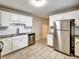 Updated kitchen with white cabinets, stainless steel appliances and granite countertops at 1625 Orlando Sw St, Atlanta, GA 30311