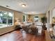 Inviting living room featuring hardwood floors, a stylish sofa, and large windows for natural light at 1625 Orlando Sw St, Atlanta, GA 30311