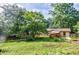 Spacious backyard with shed, garden, and covered porch perfect for outdoor enjoyment at 407 Doris Dr, Woodstock, GA 30188