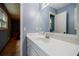 Bathroom featuring a large mirror and vanity with natural light at 407 Doris Dr, Woodstock, GA 30188