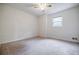 Empty bedroom with neutral walls and carpet, offering a blank canvas for personalization and comfort at 407 Doris Dr, Woodstock, GA 30188