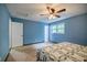 Comfortable bedroom features include a ceiling fan, natural lighting and a closet at 407 Doris Dr, Woodstock, GA 30188