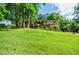 Charming two-story home with a well-maintained lawn and mature trees, offering a welcoming and picturesque setting at 407 Doris Dr, Woodstock, GA 30188