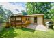 Home exterior featuring a covered patio, brick pavers, and grill for outdoor cooking at 407 Doris Dr, Woodstock, GA 30188