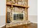 Detailed view of a stone fireplace with a wooden mantel, adding character to the living space at 407 Doris Dr, Woodstock, GA 30188