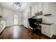 Well-lit kitchen with updated cabinetry, appliances, and a convenient desk area at 407 Doris Dr, Woodstock, GA 30188