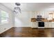 Bright eat-in kitchen area featuring updated white cabinets, modern appliances, and a stylish light fixture at 407 Doris Dr, Woodstock, GA 30188
